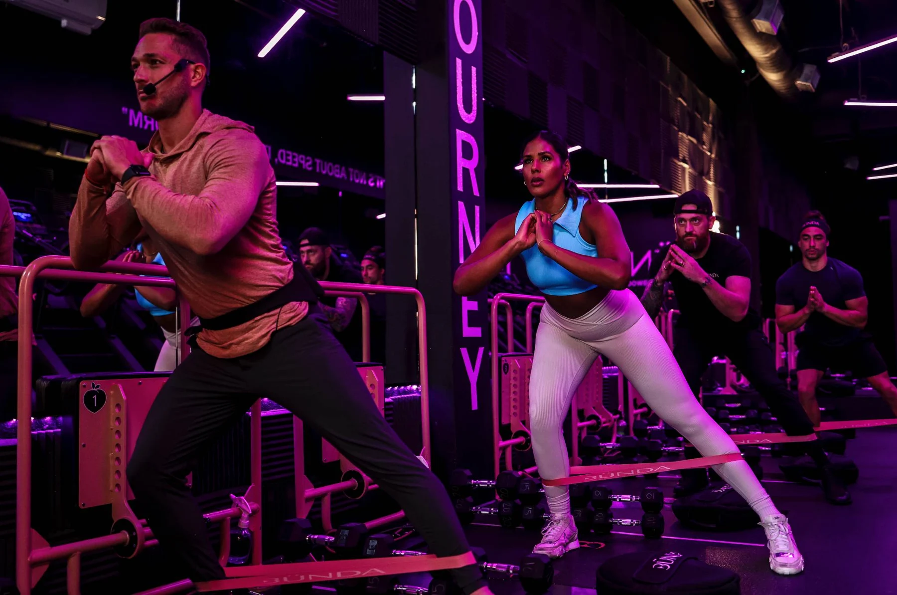 An instructor and class inside a BÜNDA studio