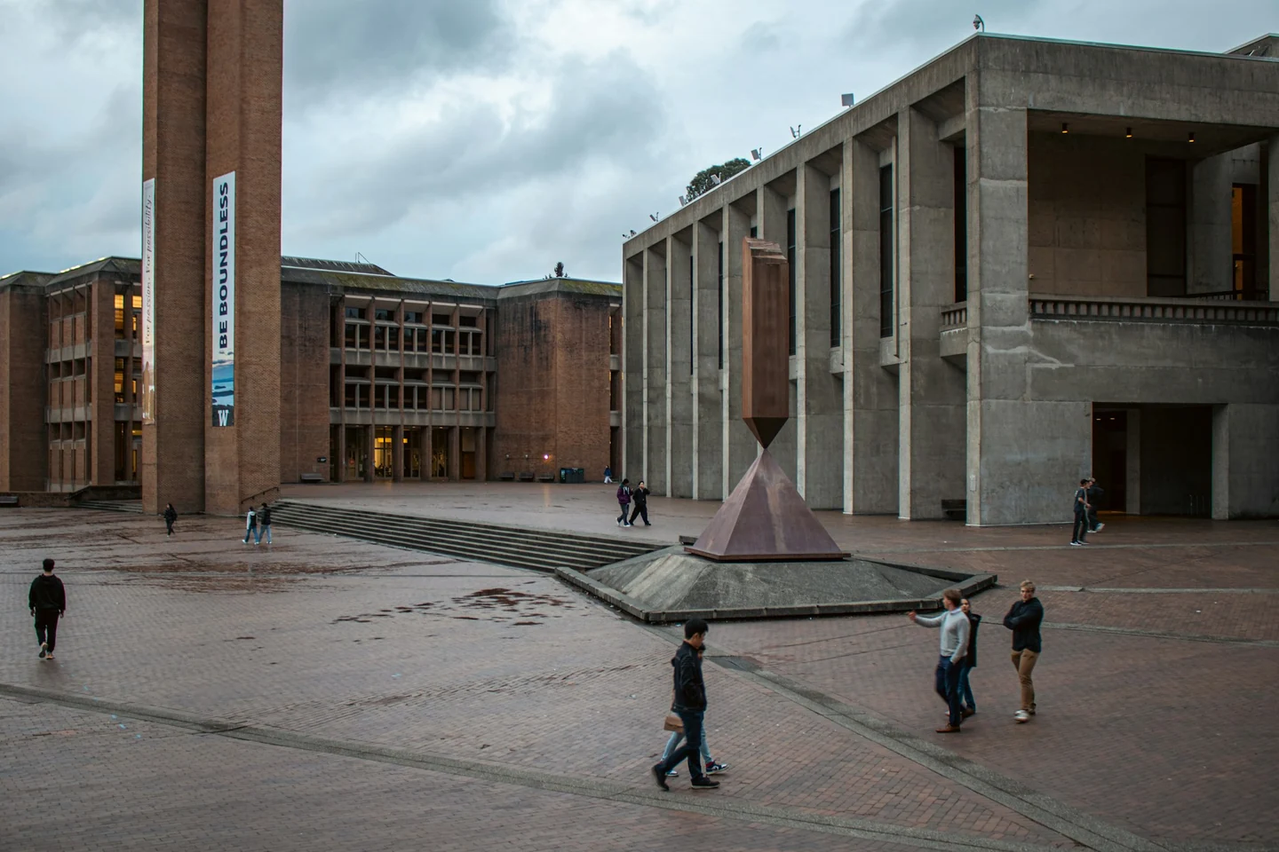 People crossing a university campus